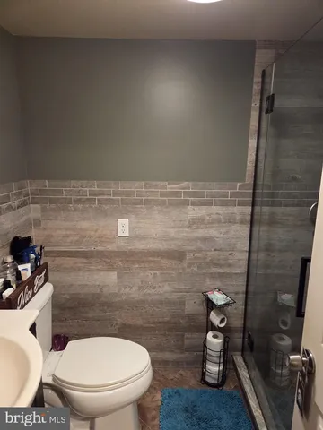 a utility room with cabinets washer and dryer