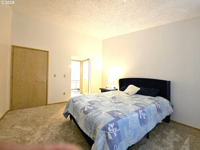a spacious bathroom with a double vanity sink and a mirror