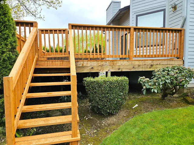 a view of balcony with wooden floor and seating space