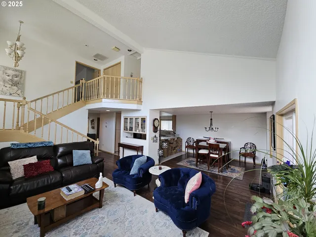 a living room with furniture a fireplace and book shelf