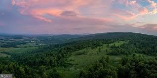 2613 Lookout Road Haymarket, VA 20169 - Photo 5 of 14 a view of a big yard with lots of green space and mountain view