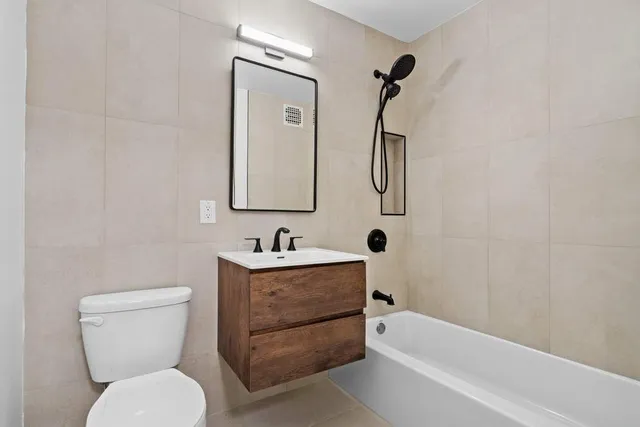 a bathroom with a toilet sink and bathtub