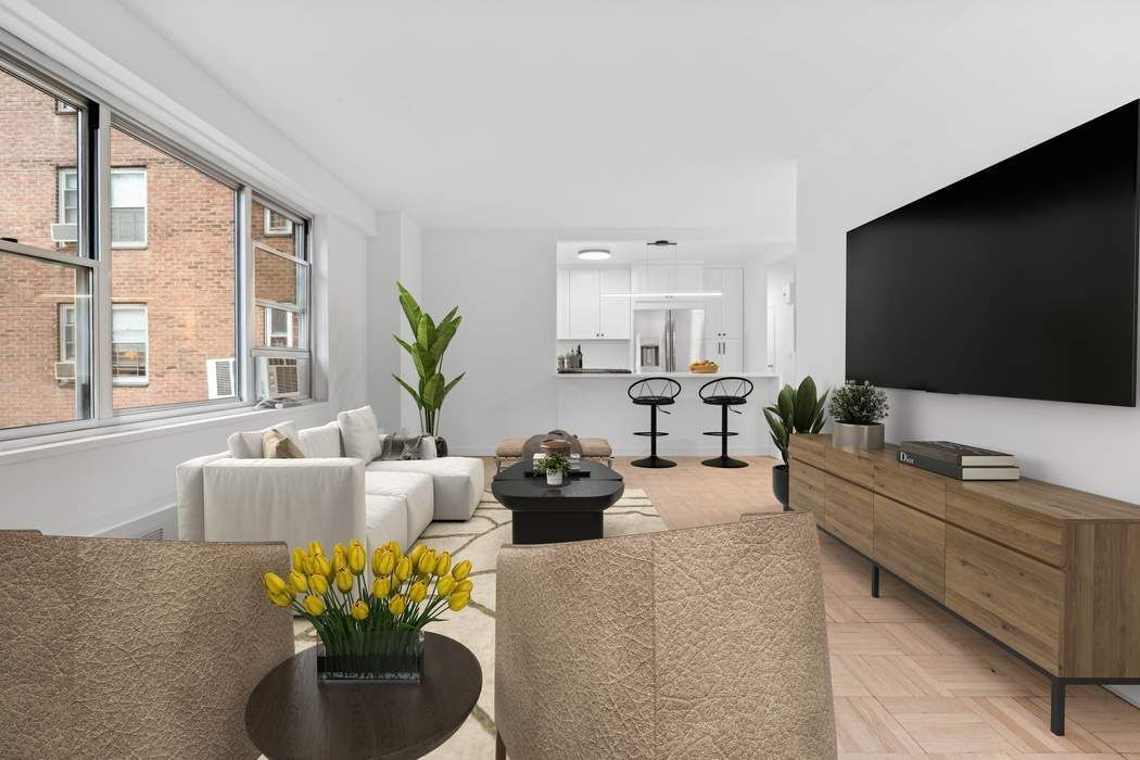 475 FDR Drive, Unit L804 Manhattan, NY 10002 - Photo 6 of 17 a living room with furniture a flat screen tv and a large window