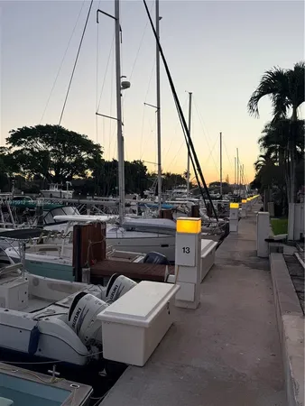 a kitchen with granite countertop a sink and cabinets