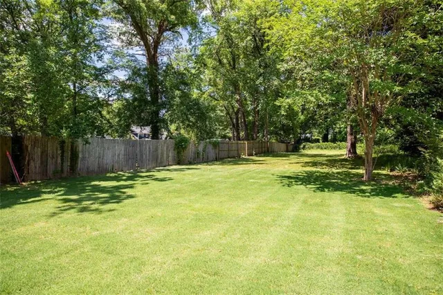 a swimming pool with wooden fence