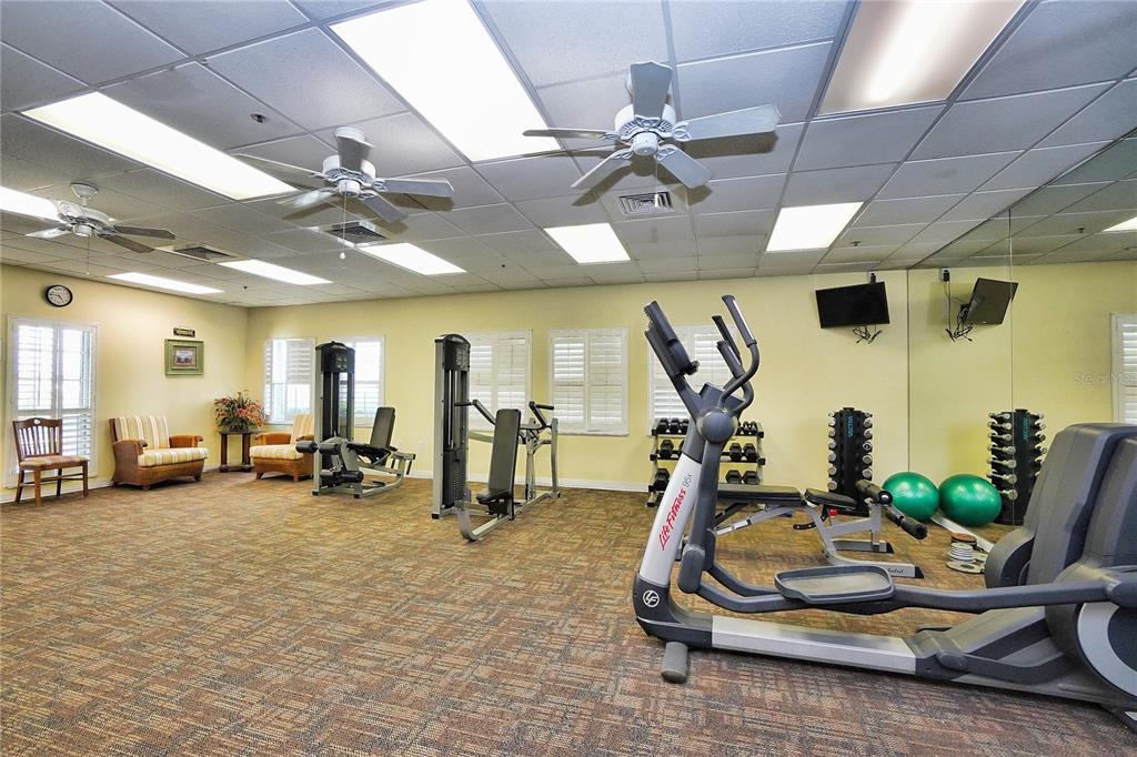 24504 Buckingham Way Punta Gorda, FL 33980 - Photo 39 of 42 a room with gym equipment and a view of gym equipment