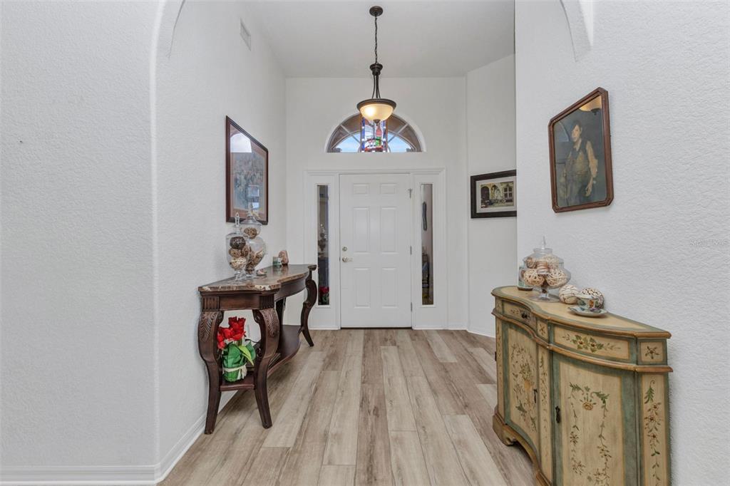 24504 Buckingham Way Punta Gorda, FL 33980 - Photo 4 of 42 a living room with furniture and a wooden floor
