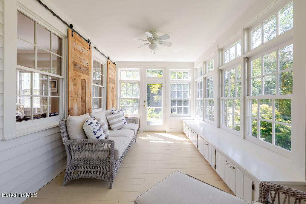 454 Main Road, Unit 2 Monterey, MA 01245 - Photo 14 of 30 a spacious bedroom with furniture and a large window