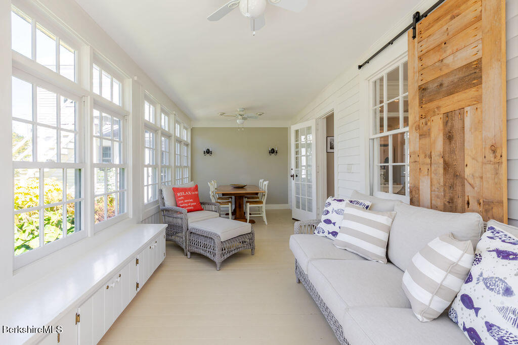 454 Main Road, Unit 2 Monterey, MA 01245 - Photo 15 of 30 a living room with furniture and a large window