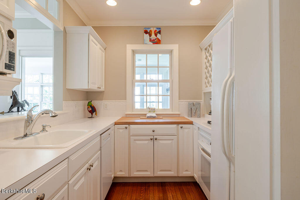 454 Main Road, Unit 2 Monterey, MA 01245 - Photo 17 of 30 a kitchen with a sink a window and cabinets