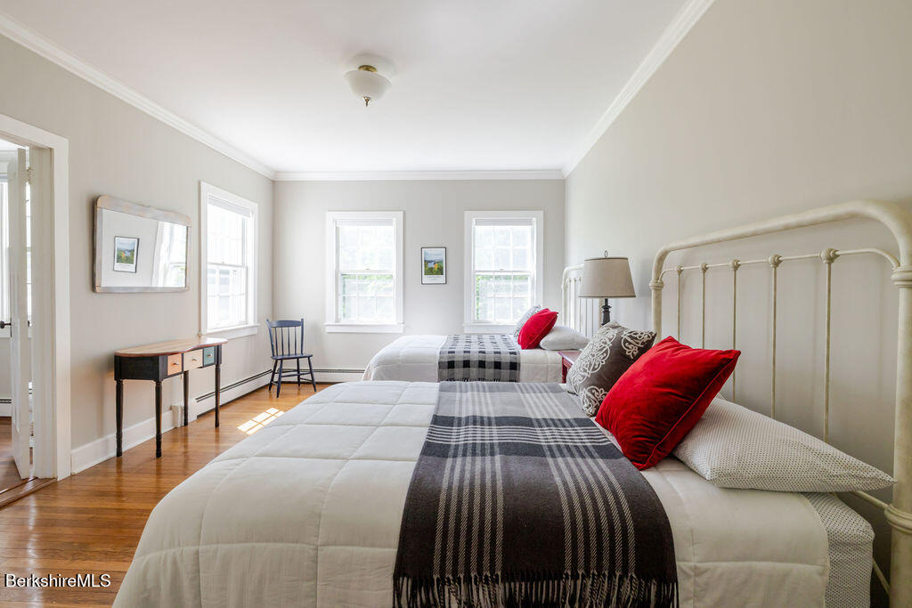 454 Main Road, Unit 2 Monterey, MA 01245 - Photo 20 of 30 a bedroom with two beds and a couch