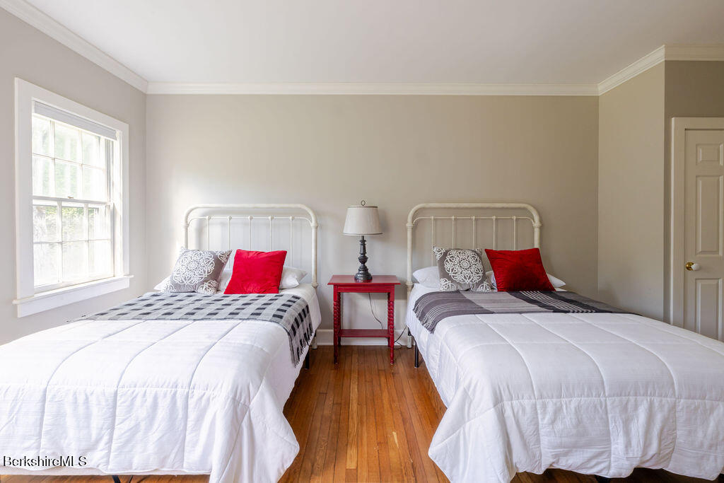 454 Main Road, Unit 2 Monterey, MA 01245 - Photo 21 of 30 a bedroom with two beds and a window