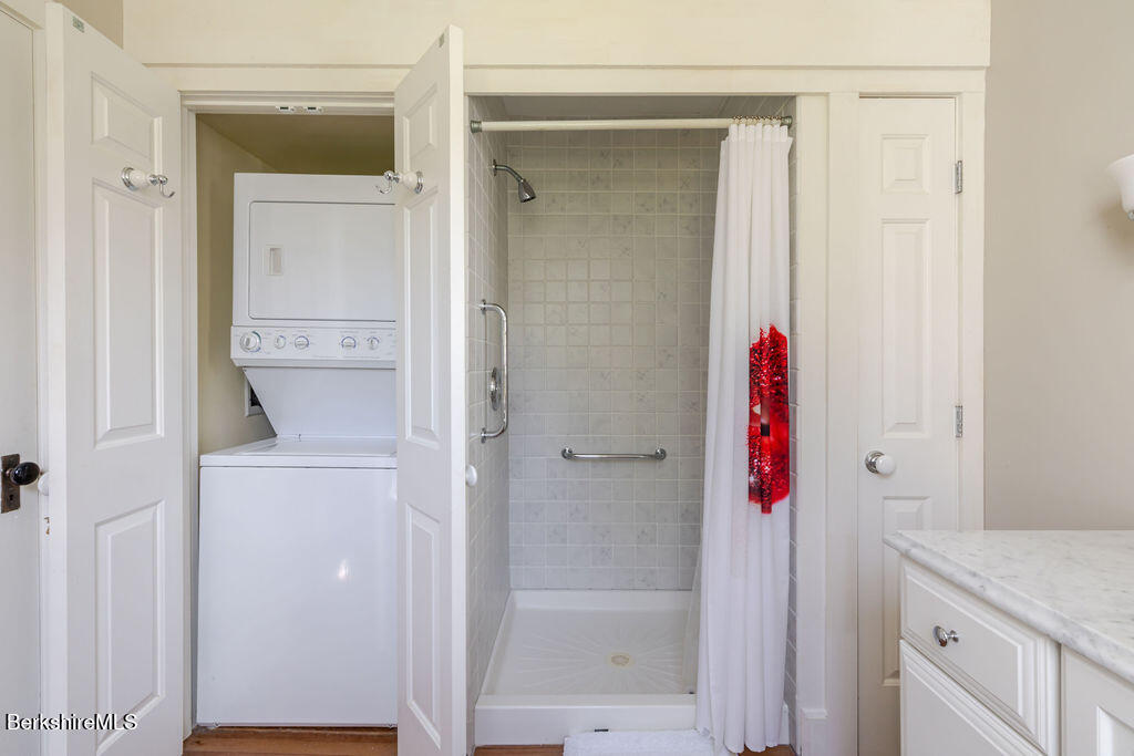 454 Main Road, Unit 2 Monterey, MA 01245 - Photo 25 of 30 a bathroom with a shower and a sink