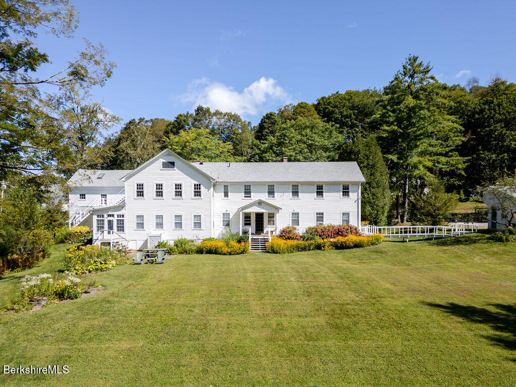 454 Main Road, Unit 2 Monterey, MA 01245 - Photo 3 of 30 a front view of house with yard and swimming pool