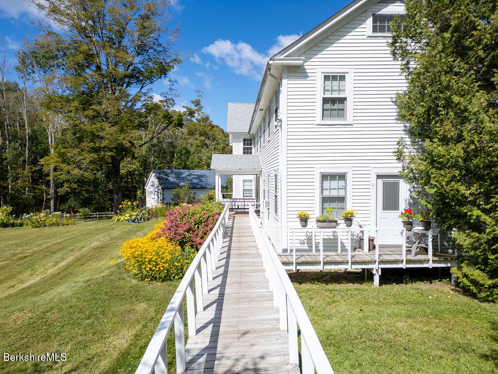 454 Main Road, Unit 2 Monterey, MA 01245 - Photo 5 of 30 a view of a house with backyard
