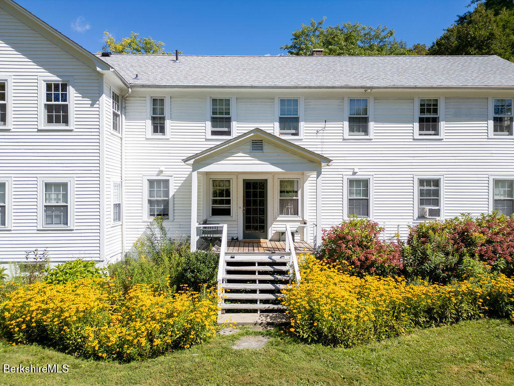 454 Main Road, Unit 2 Monterey, MA 01245 - Photo 6 of 30 a front view of a house with garden