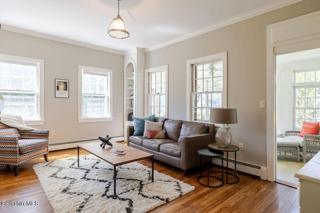454 Main Road, Unit 2 Monterey, MA 01245 - Photo 9 of 30 a living room with furniture and wooden floor