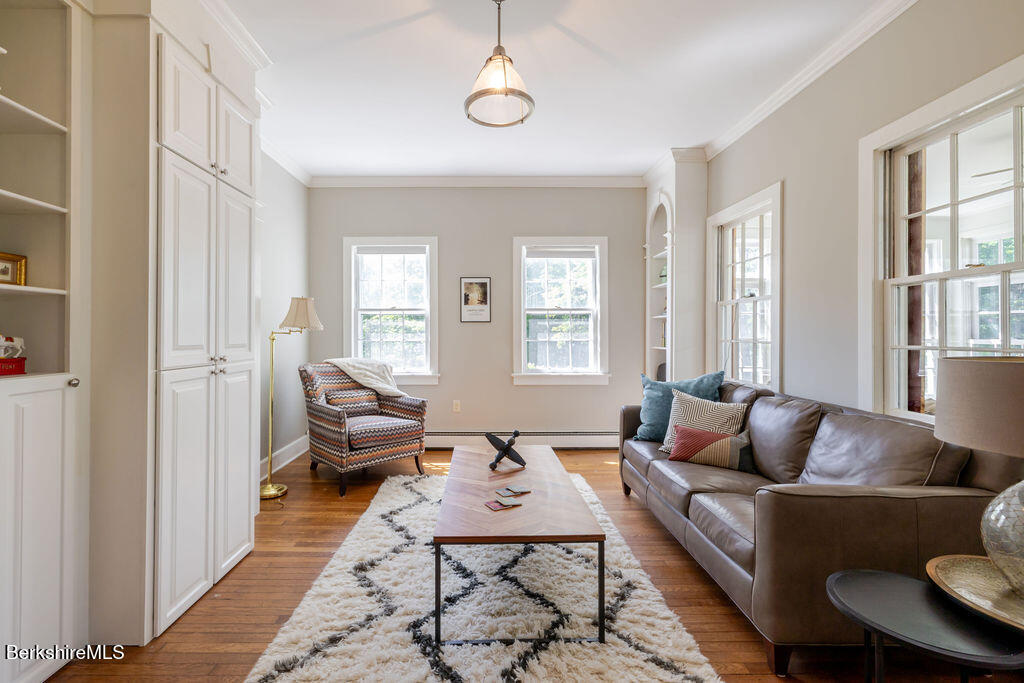 454 Main Road, Unit 2 Monterey, MA 01245 - Photo 10 of 30 a living room with furniture and wooden floor