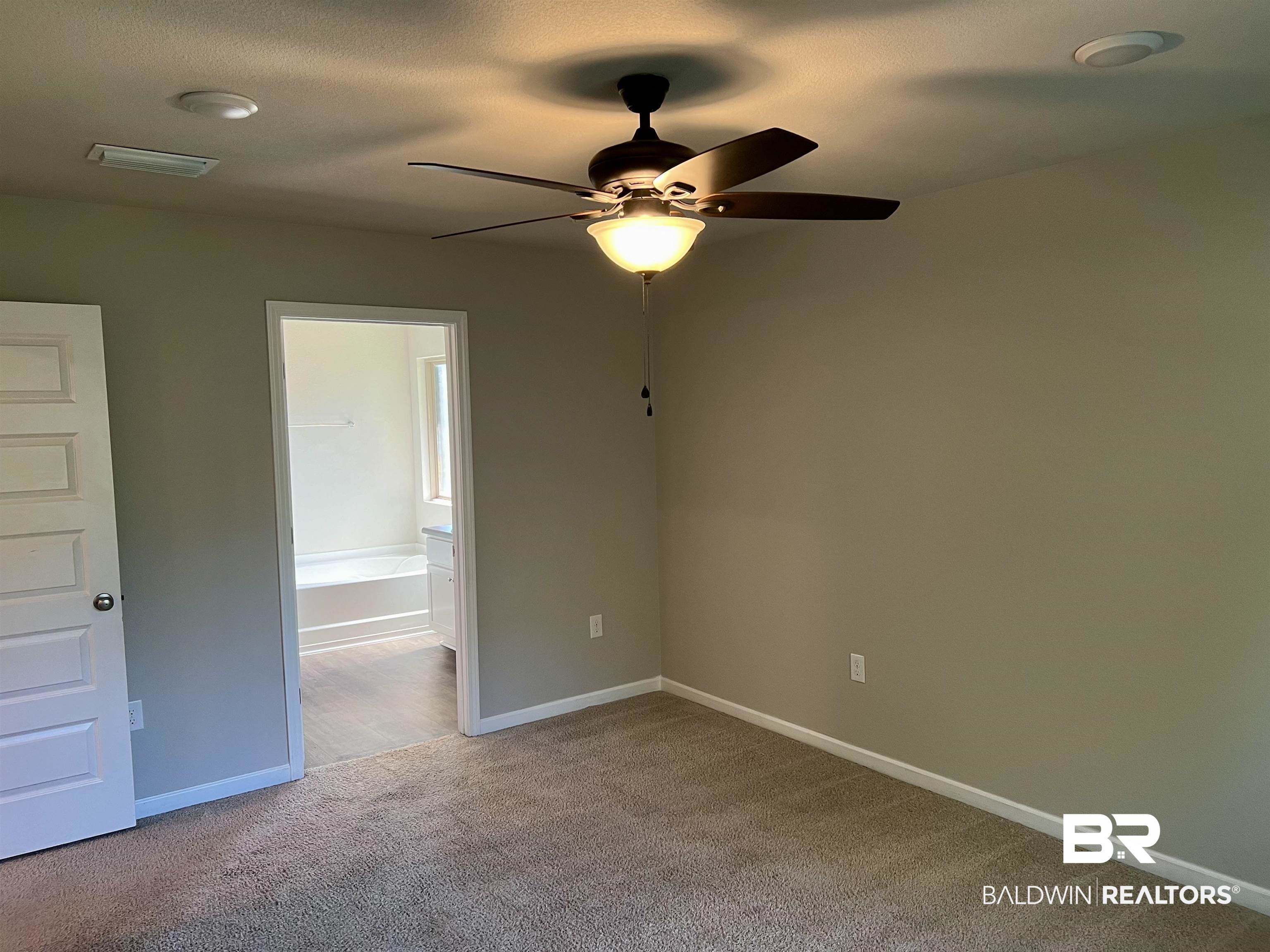 1612 Abbey Loop Foley, AL 36535 - Photo 18 of 30 Unfurnished bedroom featuring ceiling fan and light colored carpet