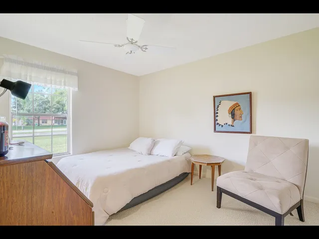 a bedroom with a bed and a couch