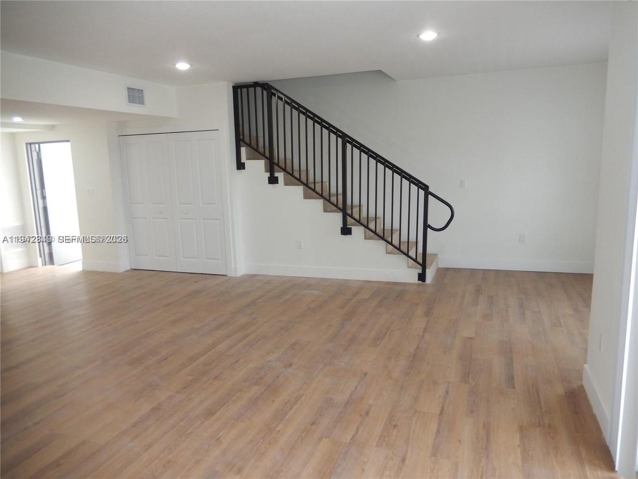 16955 Southwest 100th Avenue, Unit 9 Miami, FL 33157 - Photo 5 of 17 a view of entryway and hall with wooden floor