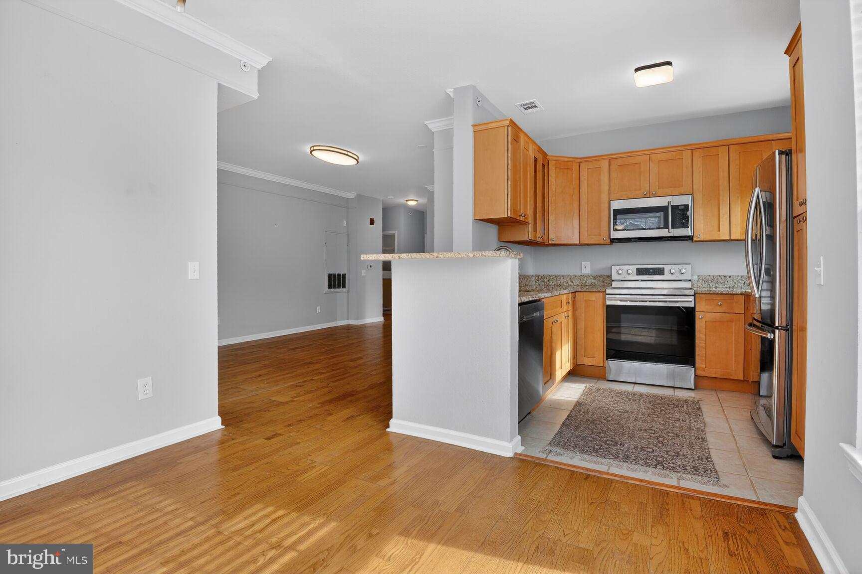 1600 Spring Gate Dr., Unit 2402 McLean, VA 22102 - Photo 13 of 33 Open Kitchen with plenty of natural light