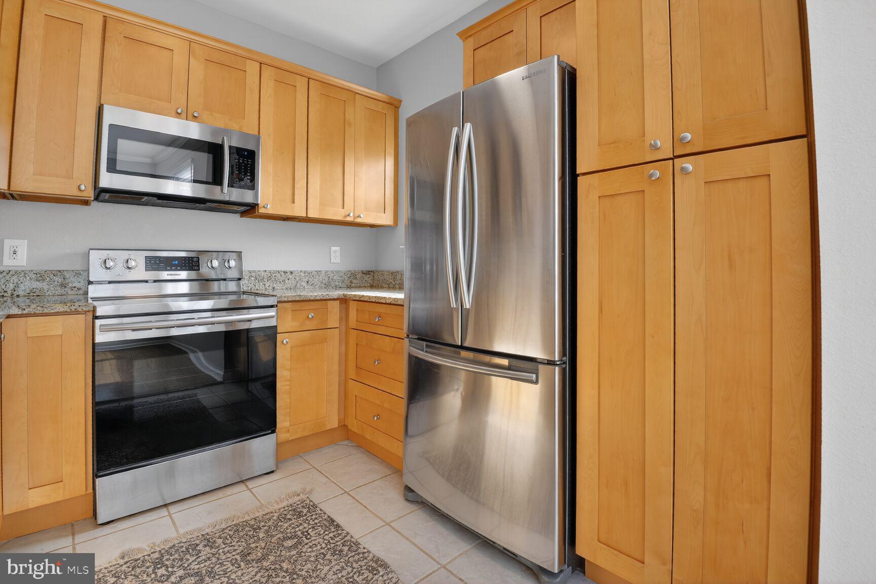 1600 Spring Gate Dr., Unit 2402 McLean, VA 22102 - Photo 6 of 33 SS appliances and updated maple kitchen cabinets