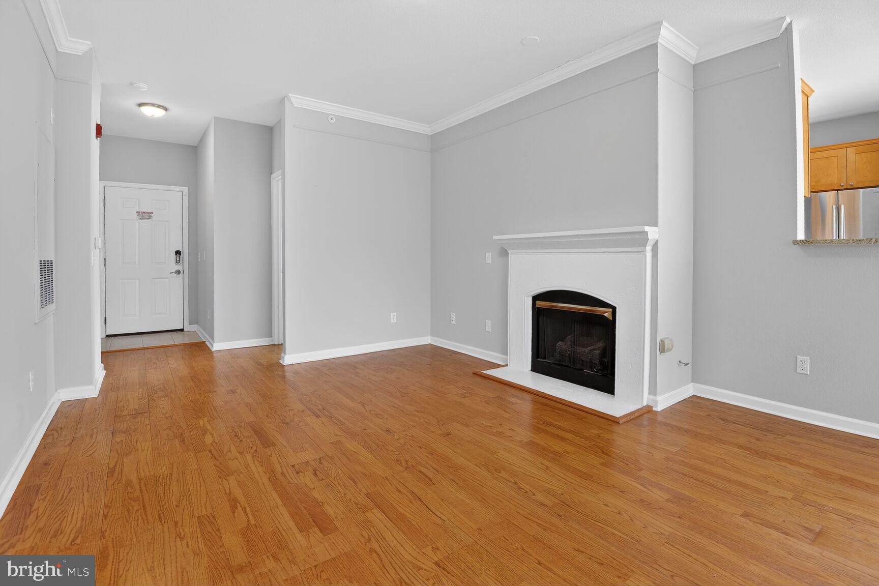 1600 Spring Gate Dr., Unit 2402 McLean, VA 22102 - Photo 8 of 33 Living room with gas burning fireplace