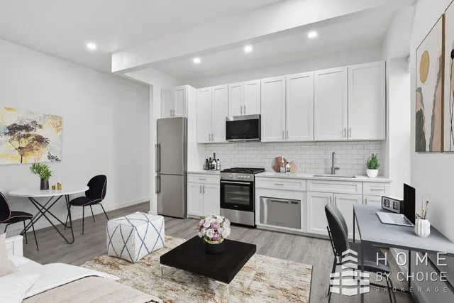 a kitchen with a dining table and appliances