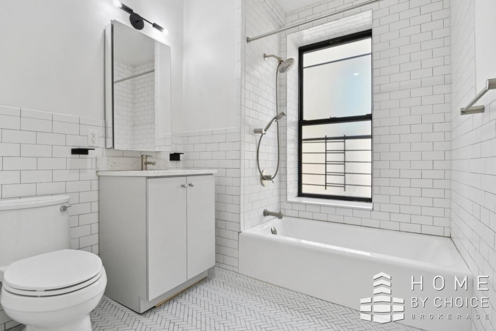 201 West 109th Street, Unit 6C Manhattan, NY 10025 - Photo 3 of 6 a bathroom with a sink toilet and shower