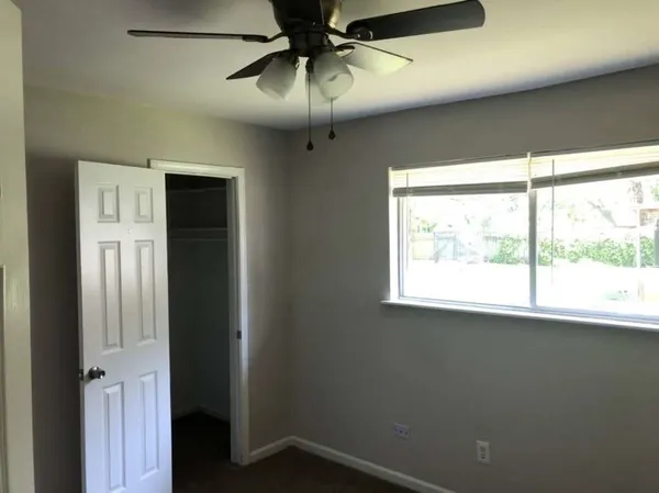 a view of an empty room with a window