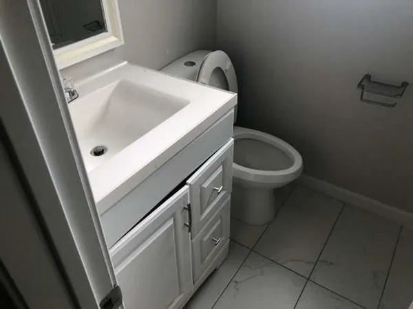 a bathroom with a sink and toilet