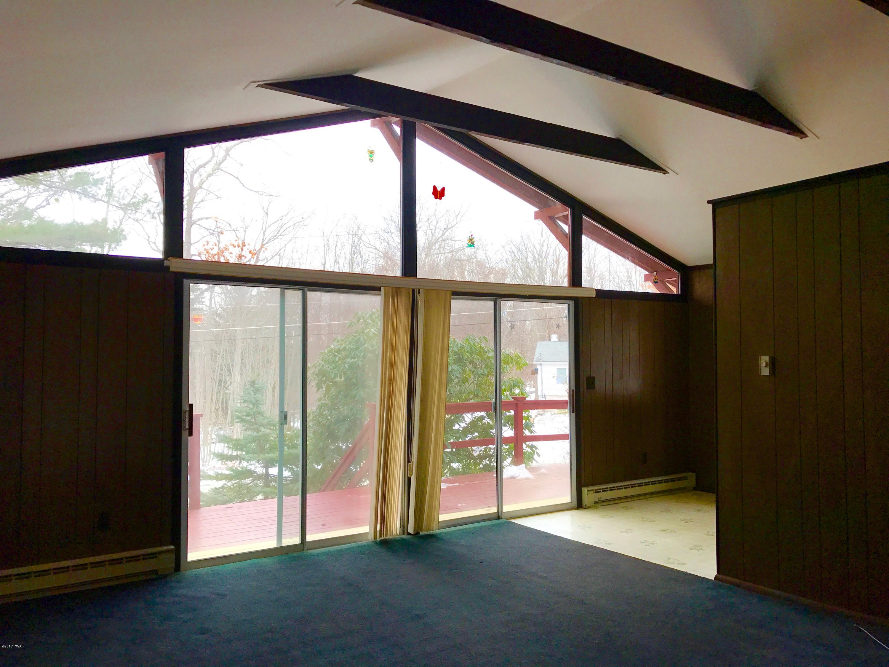 116 Sagamore Road Shohola, PA 18458 - Photo 4 of 27 SLIDERS TO DECK HW UNDER CARPET