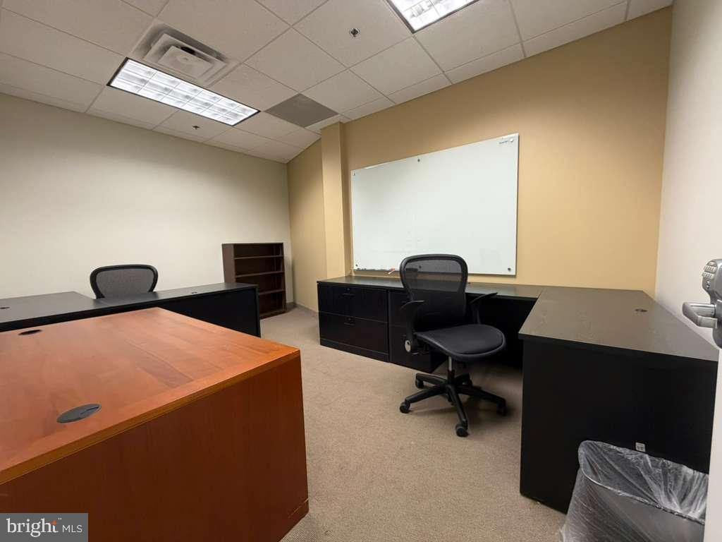 1984 Isaac Newton Square West, Unit 214 Reston, VA 20190 - Photo 2 of 8 a view of a workspace with furniture
