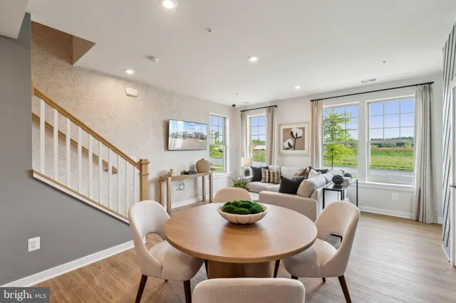 a view of a dining room with furniture window and wooden floor