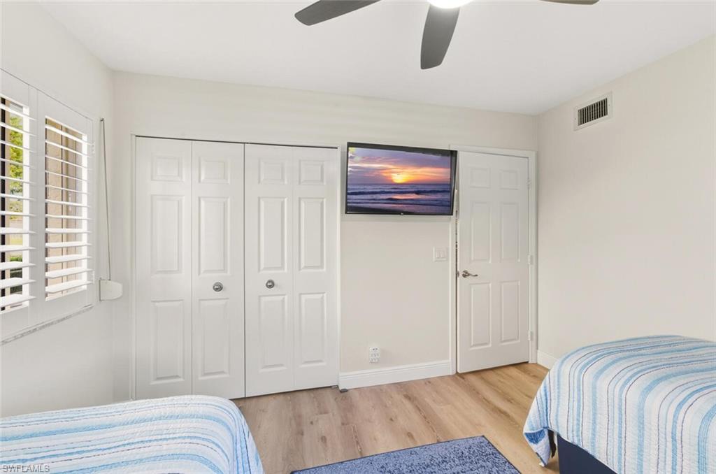 7772 Emerald Circle, Unit 101 Naples, FL 34109 - Photo 23 of 37 a view of bedroom