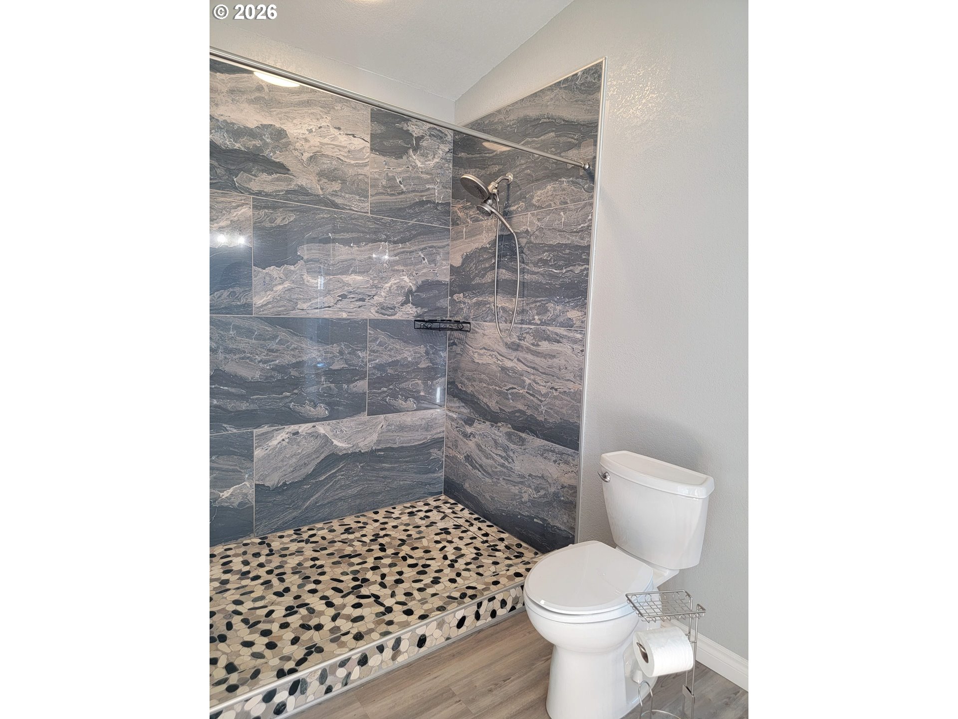 58098 Maple Circle Road Christmas Valley, OR 97641 - Photo 18 of 33 a bathroom with a toilet and a shower