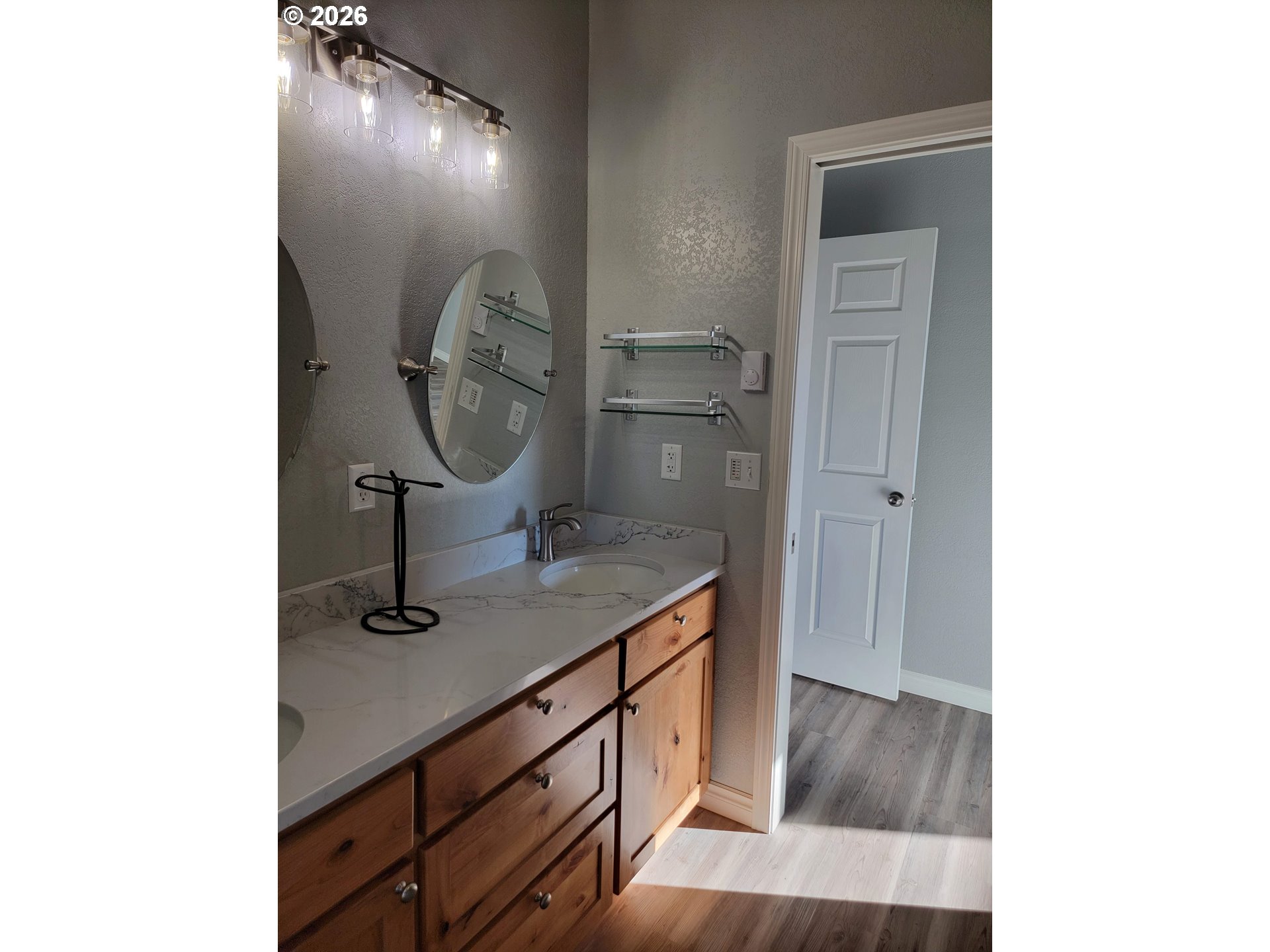 58098 Maple Circle Road Christmas Valley, OR 97641 - Photo 20 of 33 a bathroom with a sink and a mirror