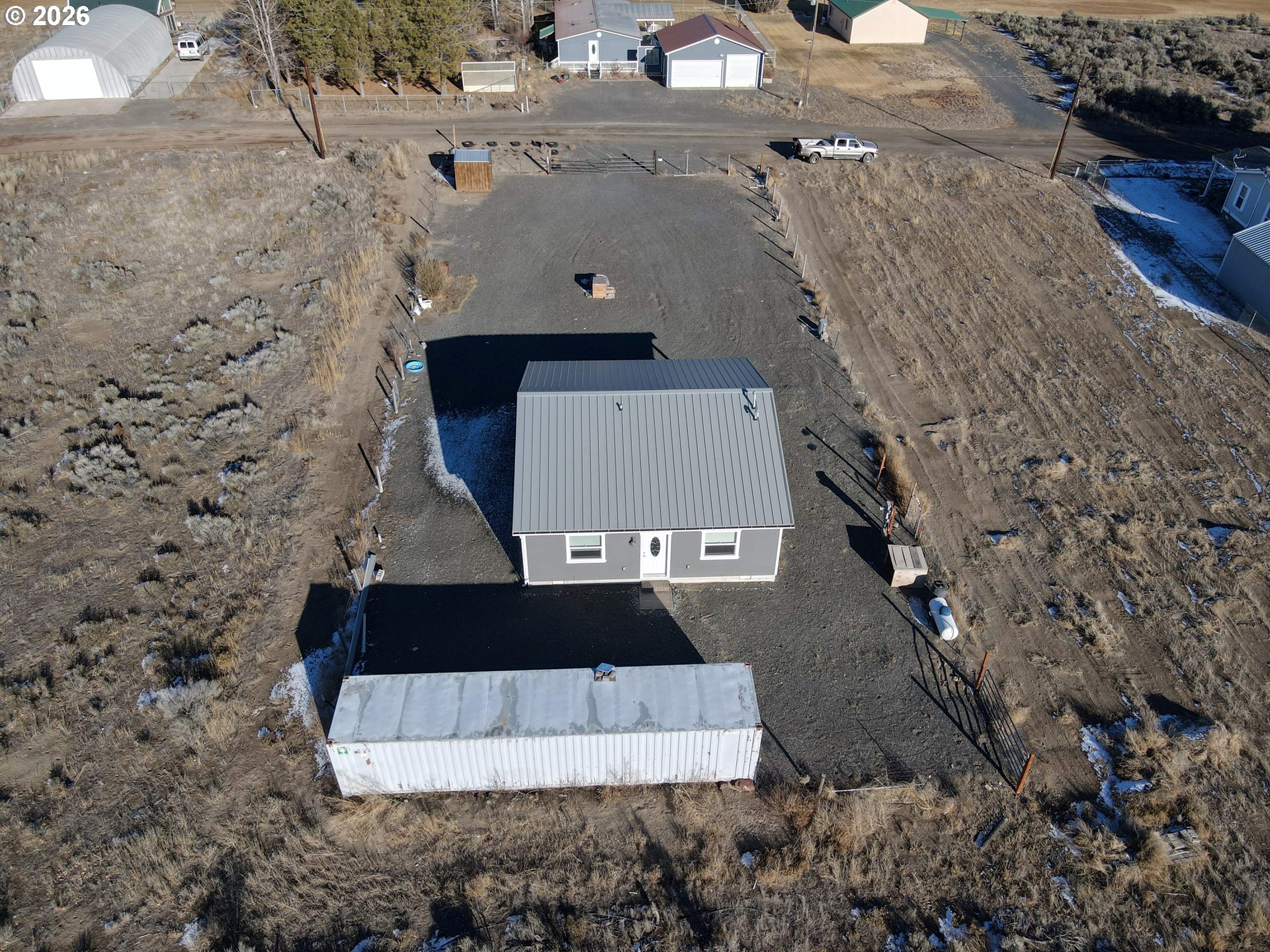 58098 Maple Circle Road Christmas Valley, OR 97641 - Photo 21 of 33 an aerial view of a house with a yard