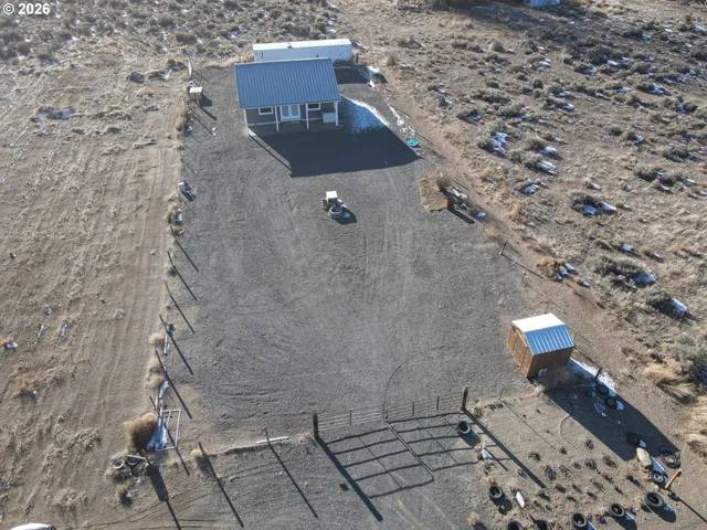 a view of a backyard with sitting area