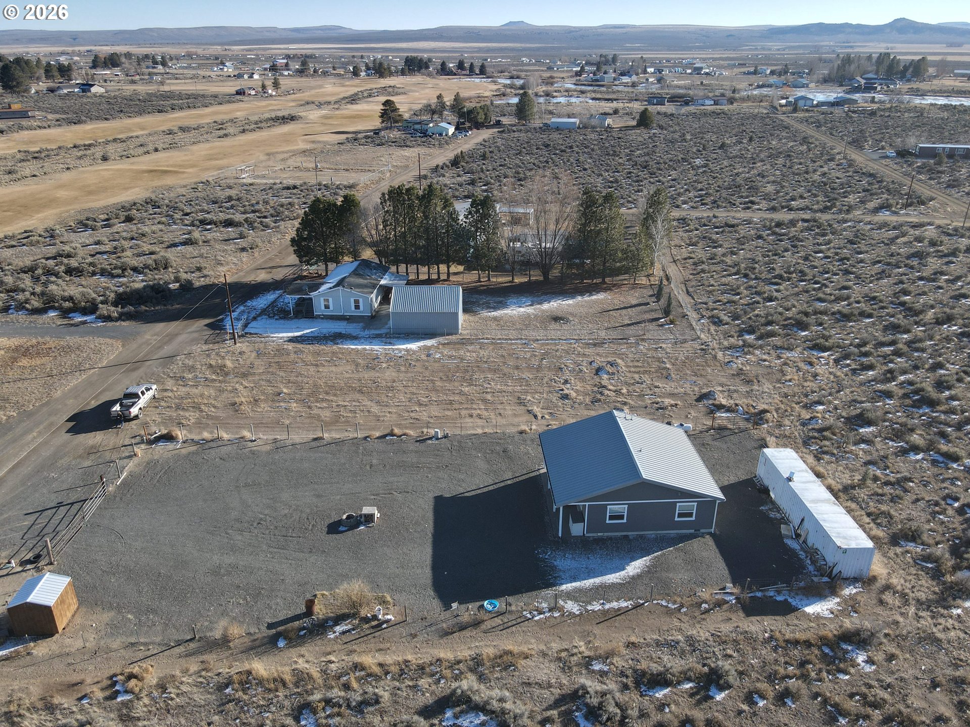 58098 Maple Circle Road Christmas Valley, OR 97641 - Photo 29 of 33 an aerial view of a house with a yard