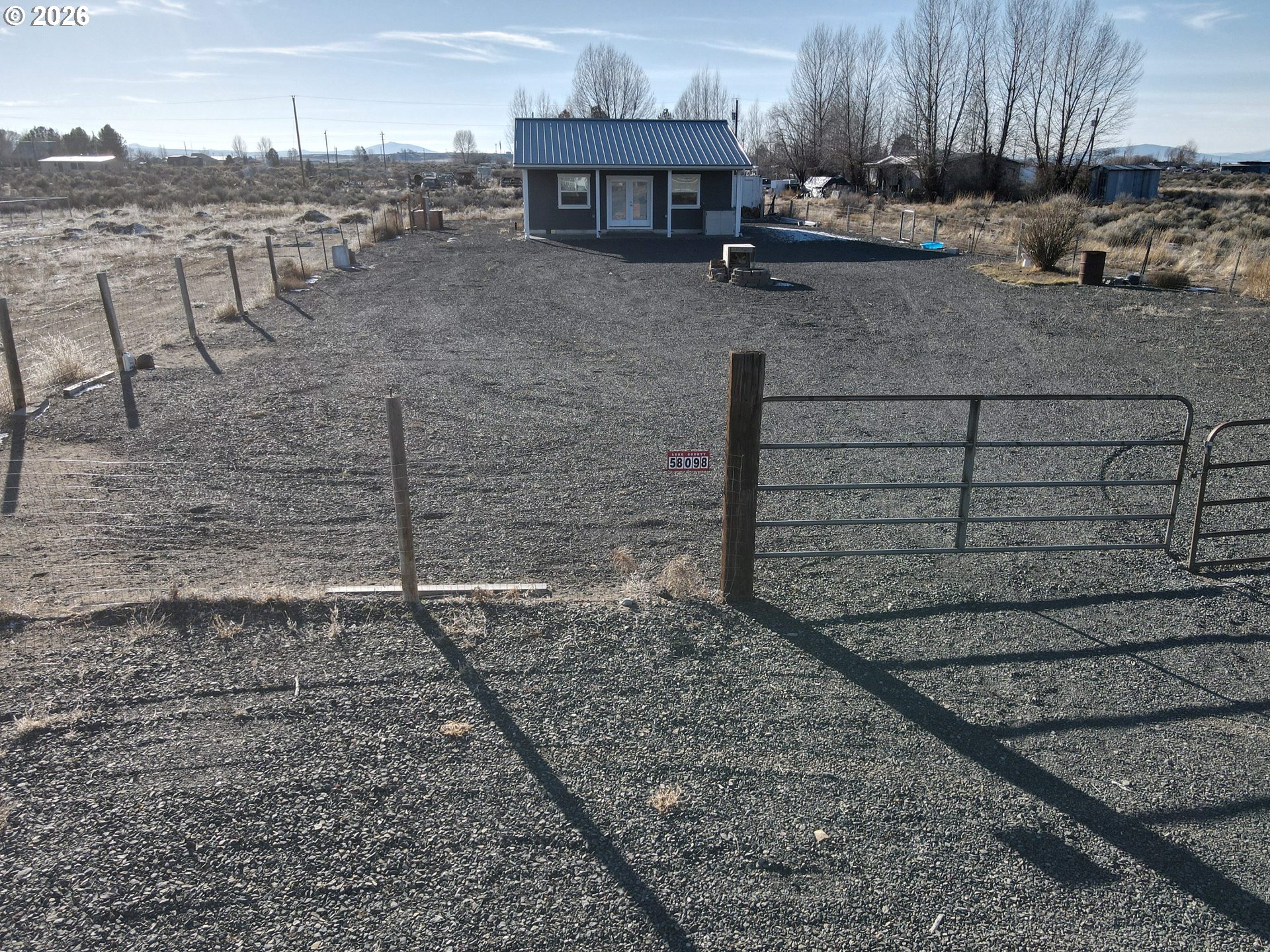 58098 Maple Circle Road Christmas Valley, OR 97641 - Photo 31 of 33 a view of a backyard with sitting area