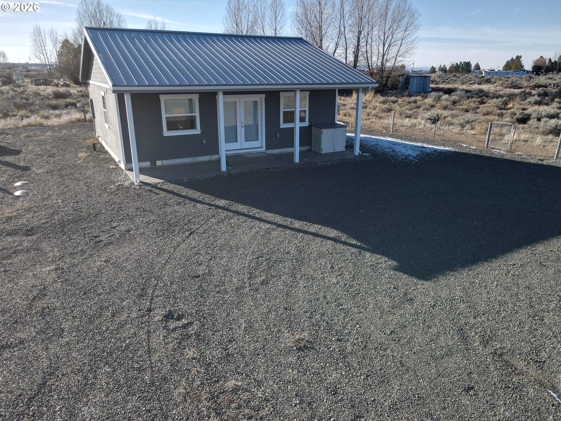 58098 Maple Circle Road Christmas Valley, OR 97641 - Photo 33 of 33 a front view of a house with a yard