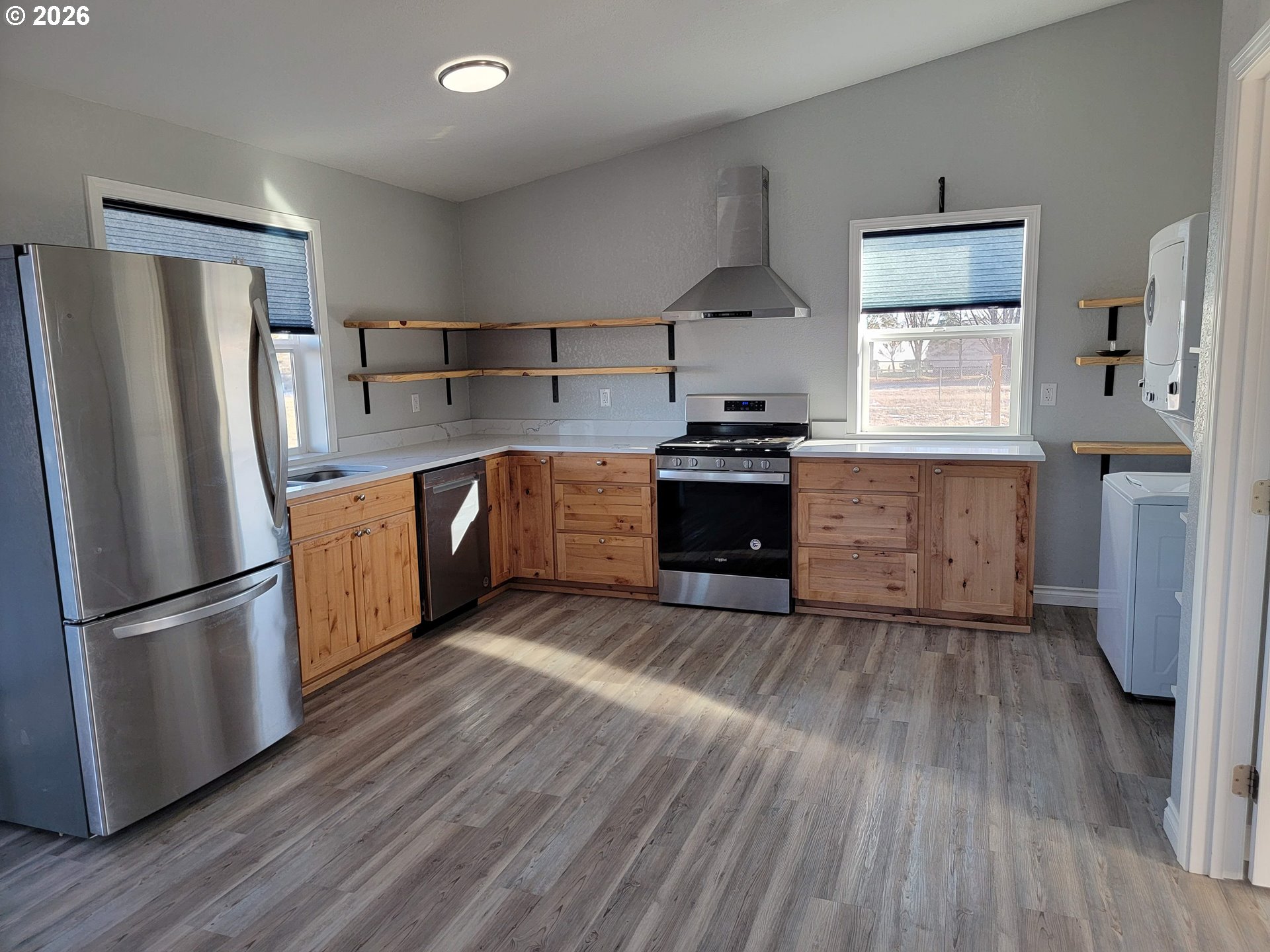 58098 Maple Circle Road Christmas Valley, OR 97641 - Photo 5 of 33 a kitchen with stainless steel appliances granite countertop a refrigerator and a stove