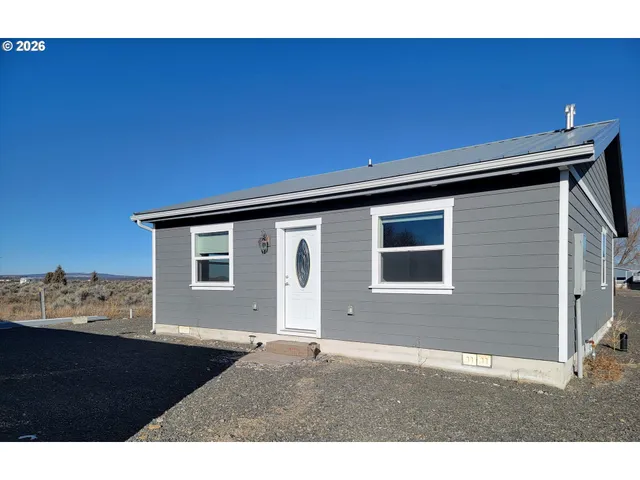 a black and white photo of a house