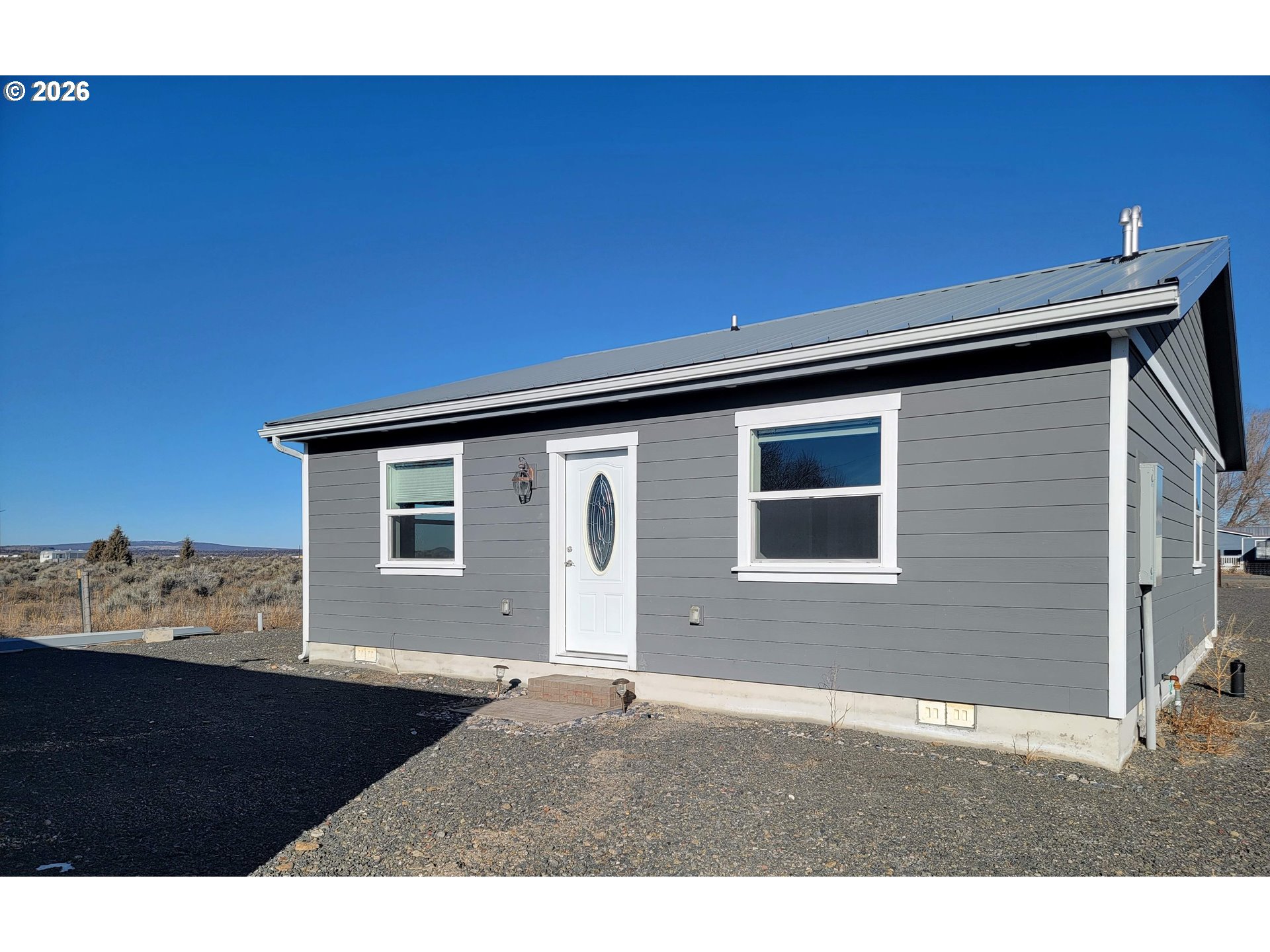 58098 Maple Circle Road Christmas Valley, OR 97641 - Photo 7 of 33 a black and white photo of a house