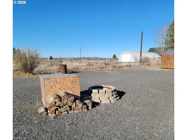 a view of a terrace with wooden fence