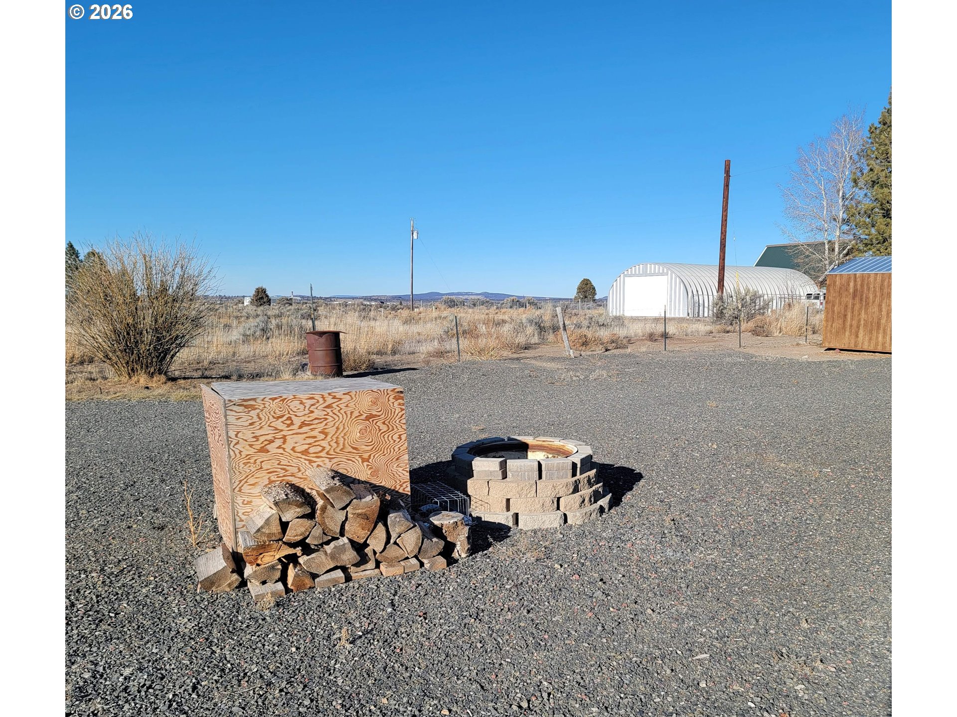 58098 Maple Circle Road Christmas Valley, OR 97641 - Photo 9 of 33 a view of a terrace with wooden fence
