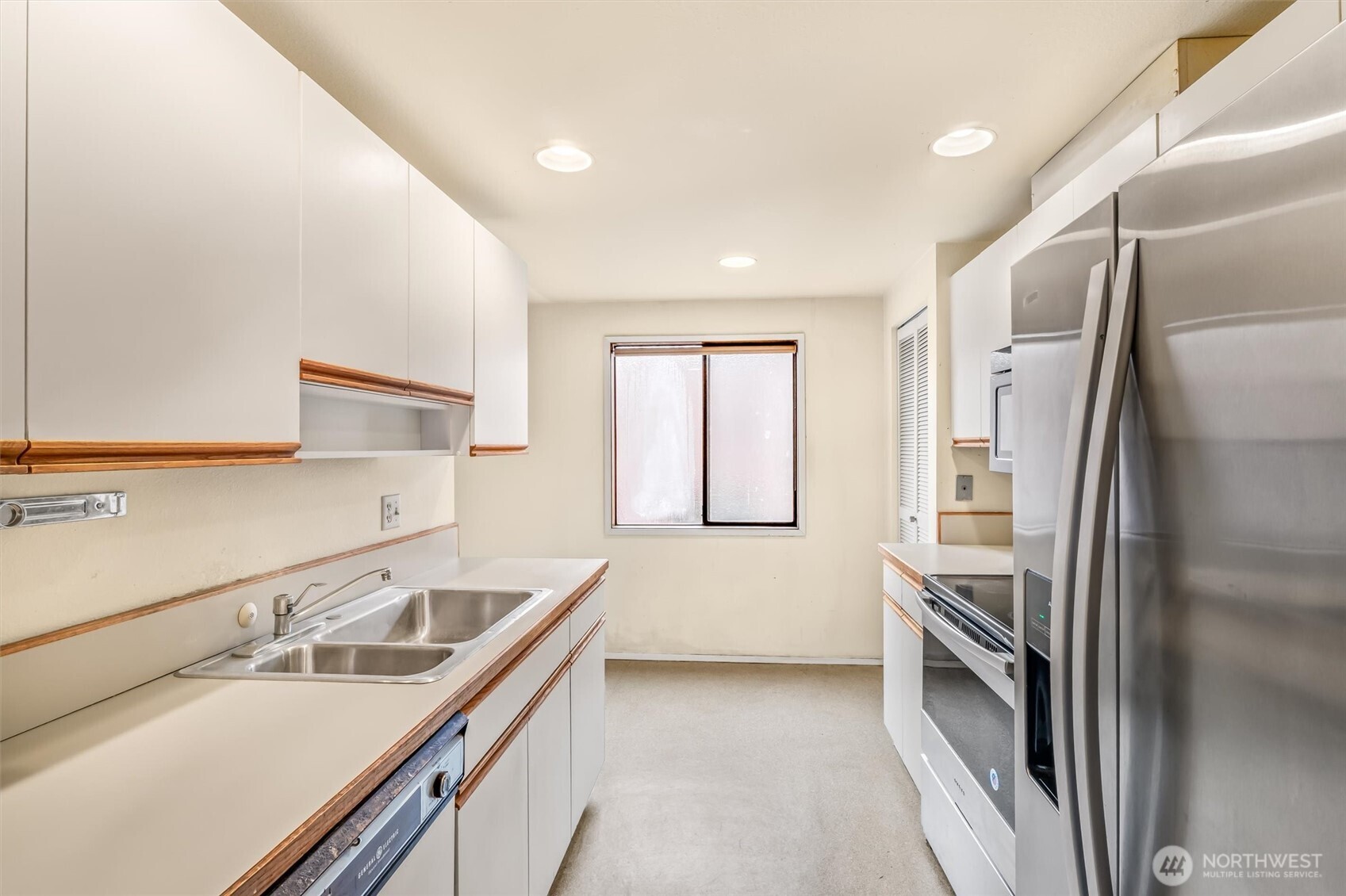 505 West Roy Street, Unit 304 Seattle, WA 98119 - Photo 11 of 33 a kitchen with a sink appliances and cabinets