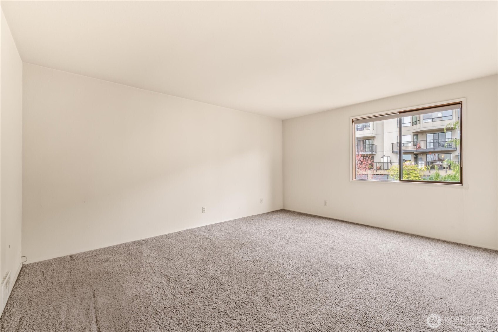 505 West Roy Street, Unit 304 Seattle, WA 98119 - Photo 15 of 33 an empty room with windows